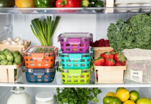 loads of vegetable and vegan staples inside a fridge