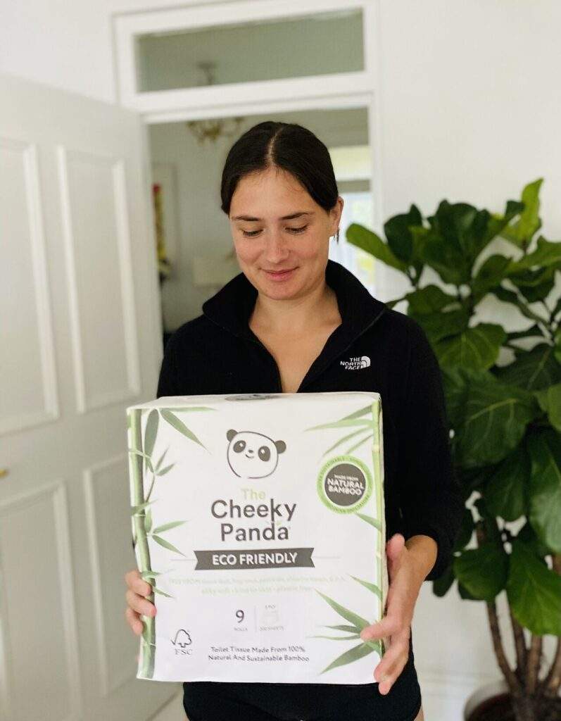 Lucy holding cheeky panda eco friendly vegan bathroom product