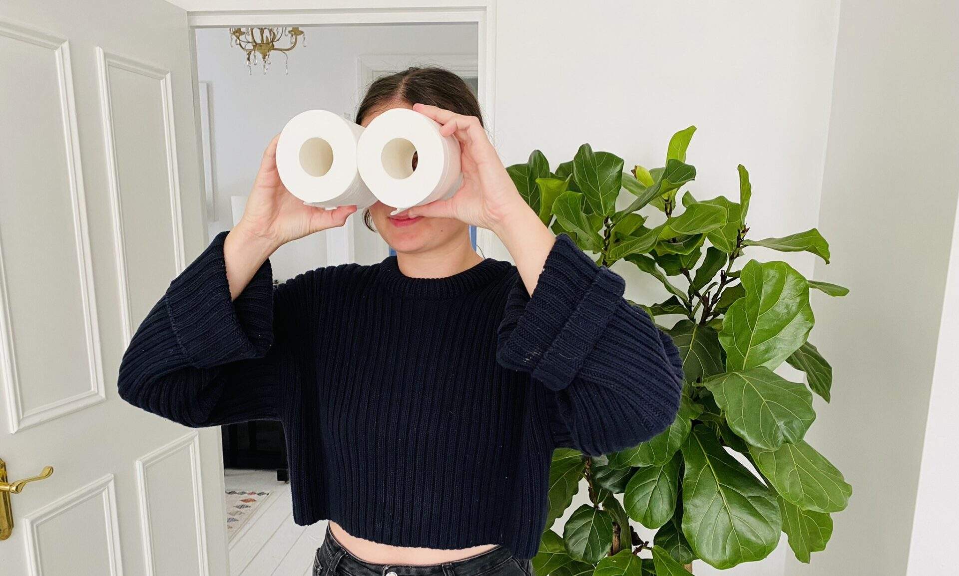 Lucy searching for the best eco toilet roll with her toilet roll binoculars