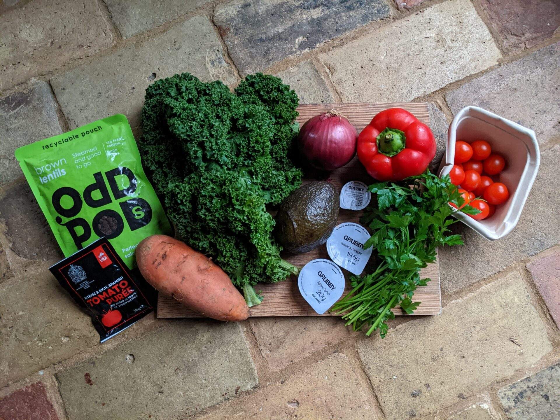 A variety of fresh plant-based ingredients from a Grubby food box