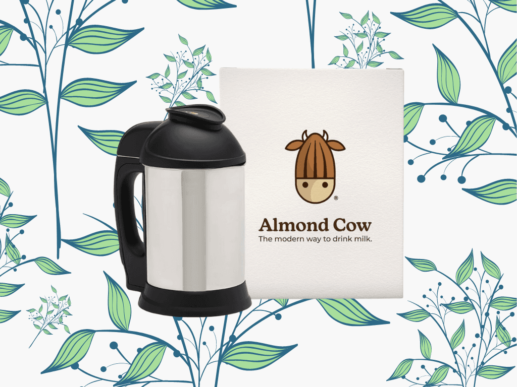 The almond cow milk maker with a nut milk bag in front of a floral background
