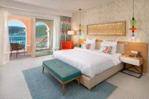 A hotel room in The Chedi, Lustica Bay. The room is beautiful with a view of the sea through the large windows