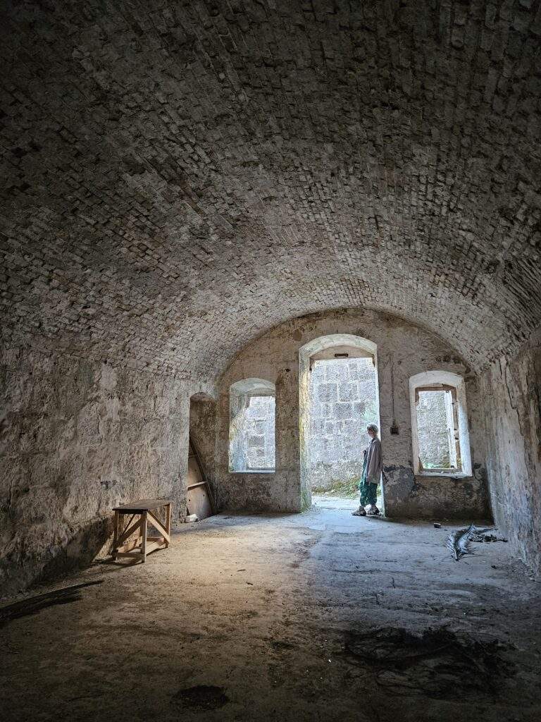 Lily is stood in the doorway to a room in Fort Kabala