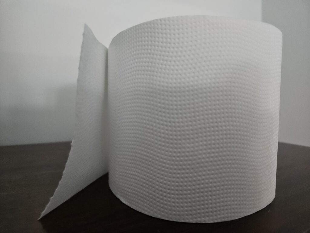A roll of toilet roll. You can see the dimpled texture of the soft and absorbent layers of Who Gives A Crap's 3-ply toilet roll.