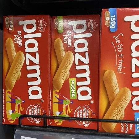 Boxes of Plasma biscuits on a supermarket shelf in Belgrade, the middle one is labelled posna and is suitable for vegans